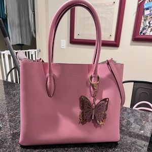 Pink Kate spade purse with butterfly keychain